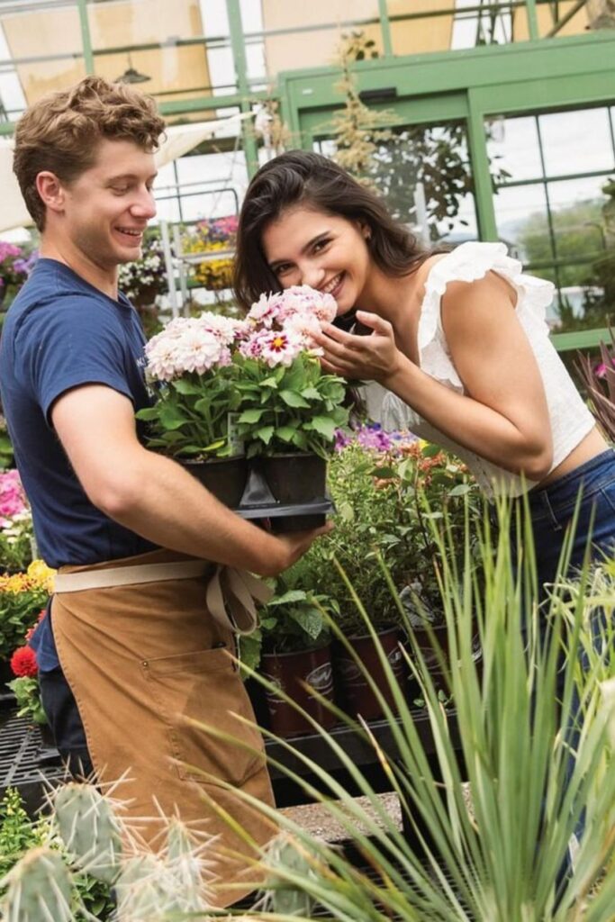 A lady buying flowers from a grower