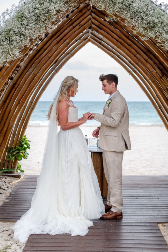 a couple Exchange Vows Under A Bamboo Arbor