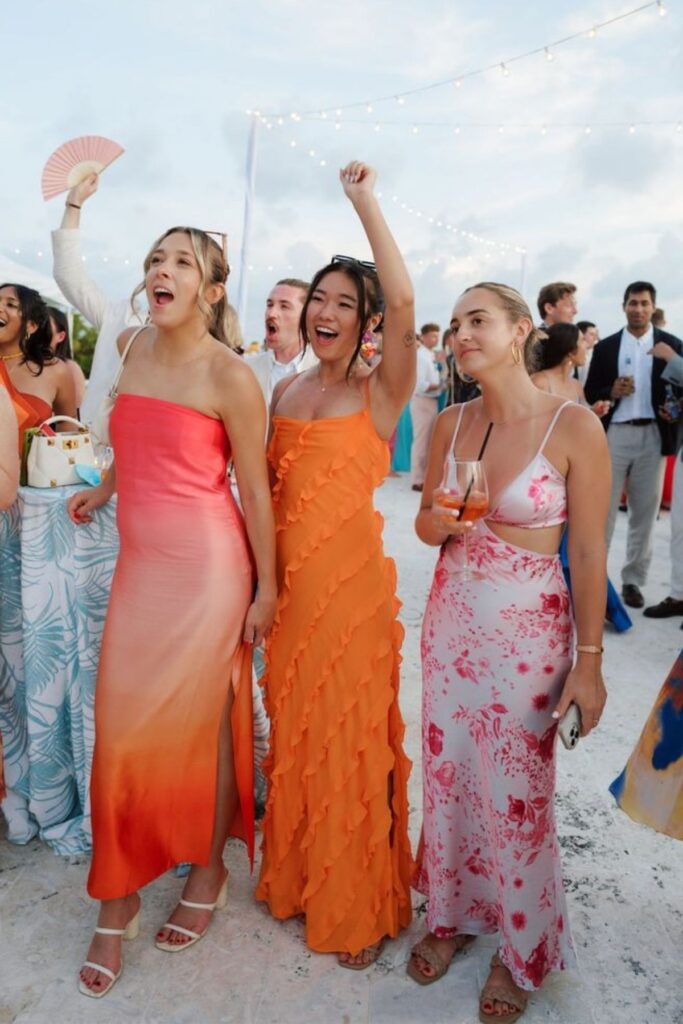 beach wedding guests that are feeling hot