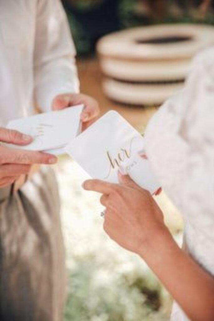exchange letters at a beach wedding