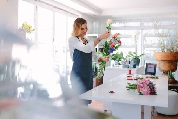 Local floral arrangement being prepared, part of the design phase in a destination wedding planning checklist.