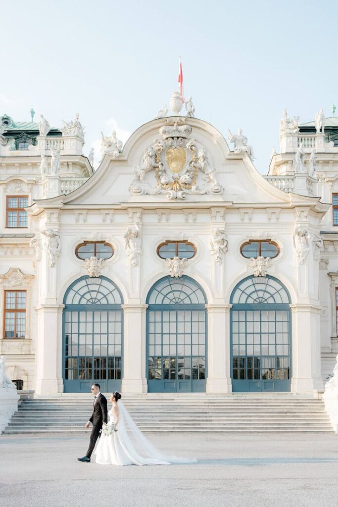 Couple walking past the Upper Belvedere Palace, one of the best wedding destinations in Europe
