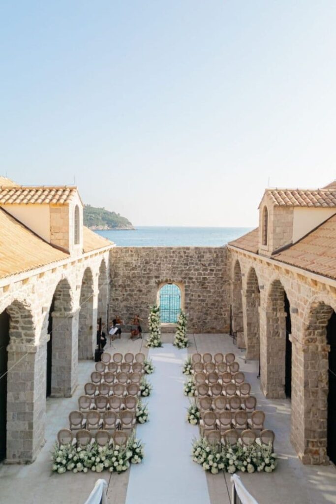  Wedding decoration overlooking Dubrovnik's ancient walls, a striking dream destination wedding location in Croatia.