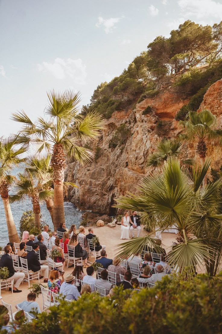 Couple and wedding guests seated at Ibiza Beach wedding
