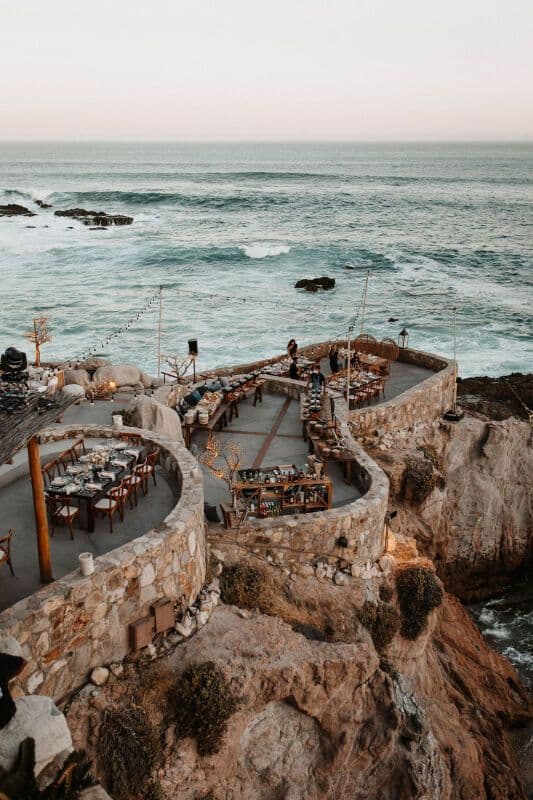 Beachfront reception at sunset, a popular dream destination wedding location in Mexico.