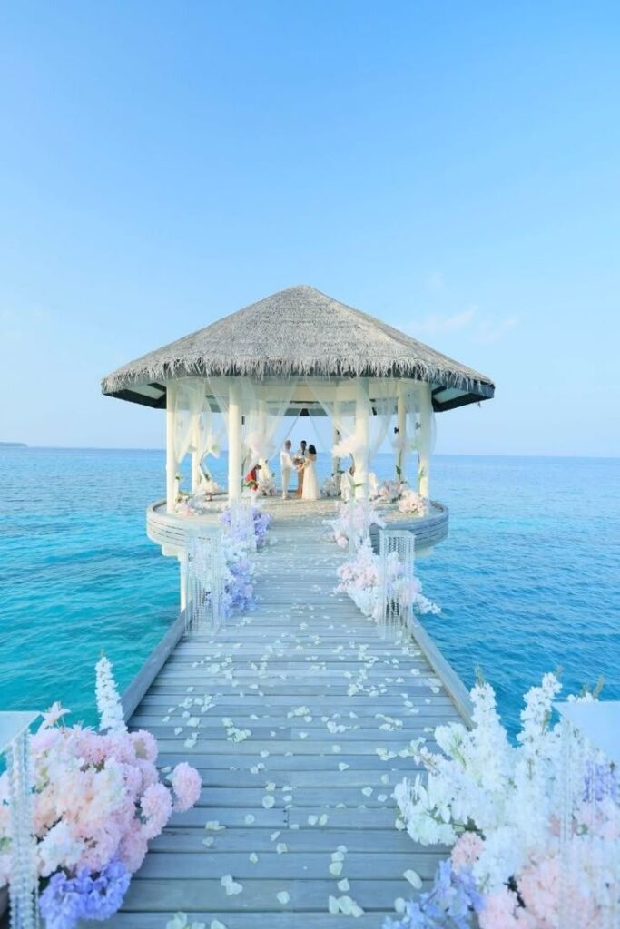 Bride and Groom exchanging their vows at Maldives Private Island